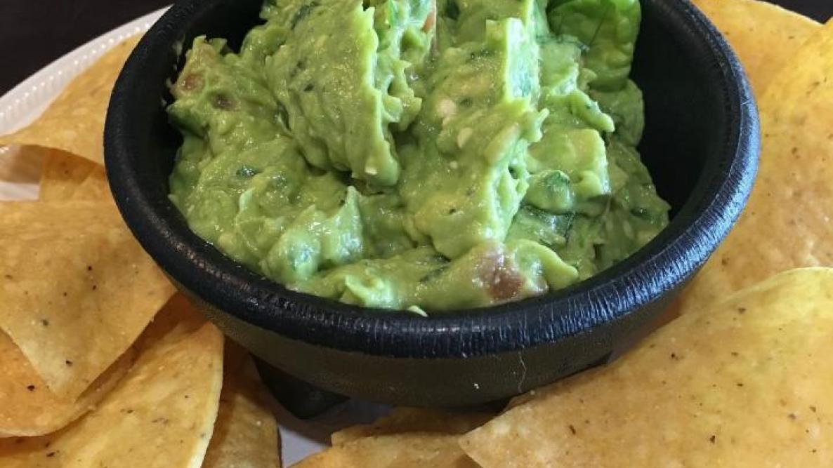 guacamole with chips on the side